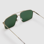 Fonda Sunglasses by Tribu Eyewear — Green polarised lens in a Silver metal aviator frame, detailed view on a grey background.