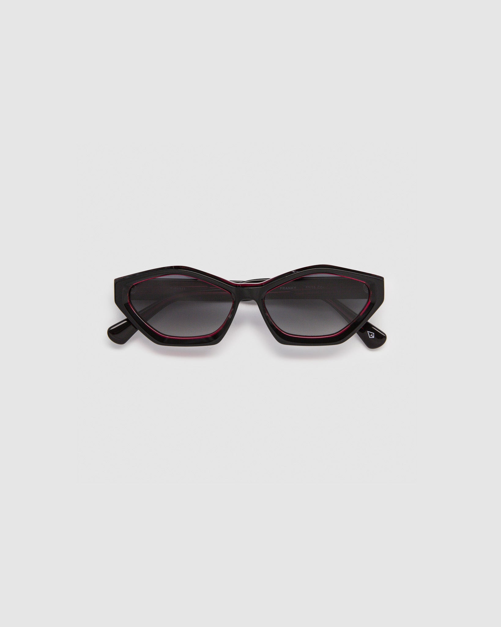 Franky Polarised Sunglasses by Tribu Eyewear — Black on Red Acetate Cat-eye frame with grey lens, flat view grey background.