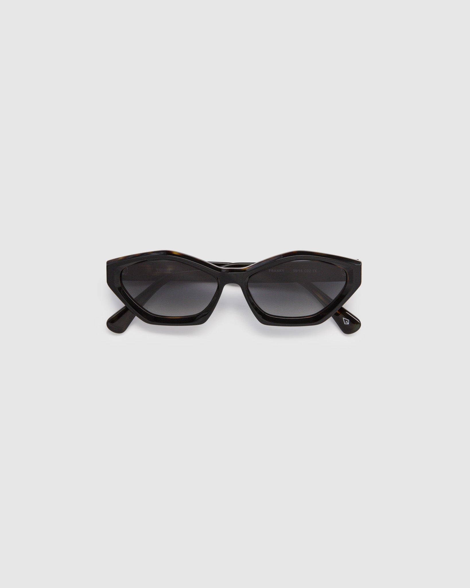 Franky Grey Polarised Sunglasses by Tribu Eyewear — Black on Tort Cat-eye frame, flat view grey background.