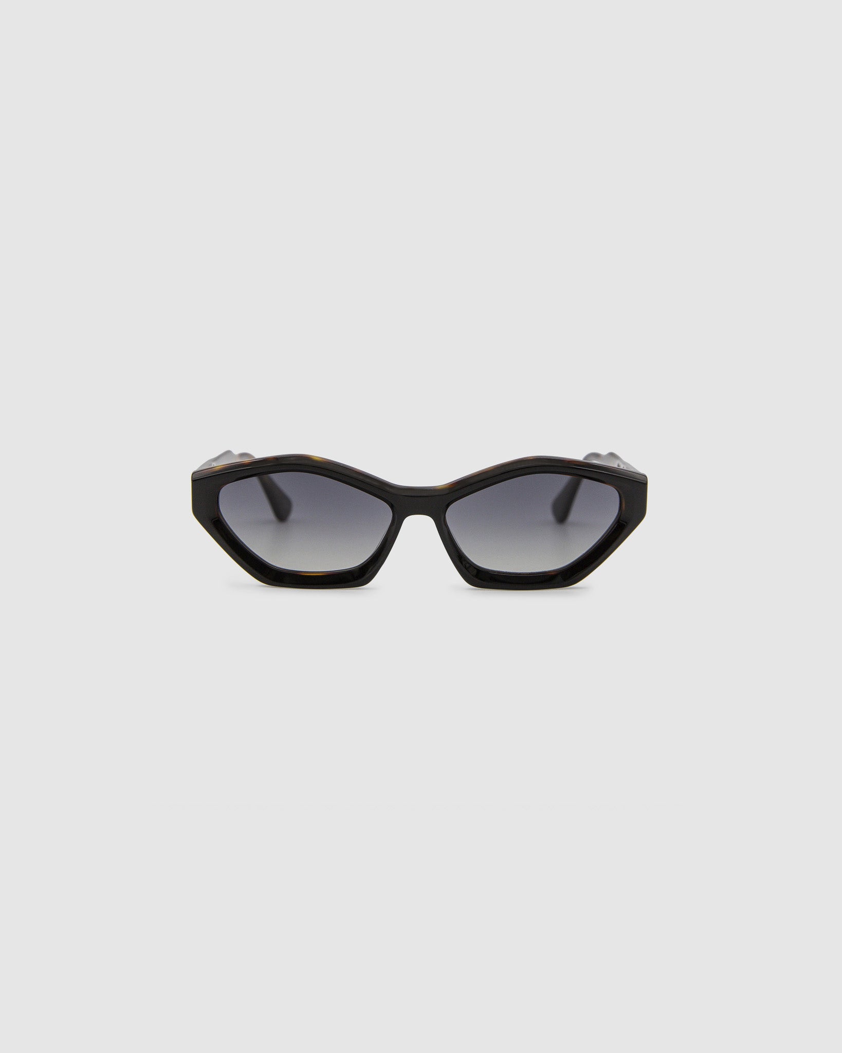 Franky Grey Polarised Sunglasses by Tribu Eyewear — Black on Tort Cat-eye frame, front view grey background.