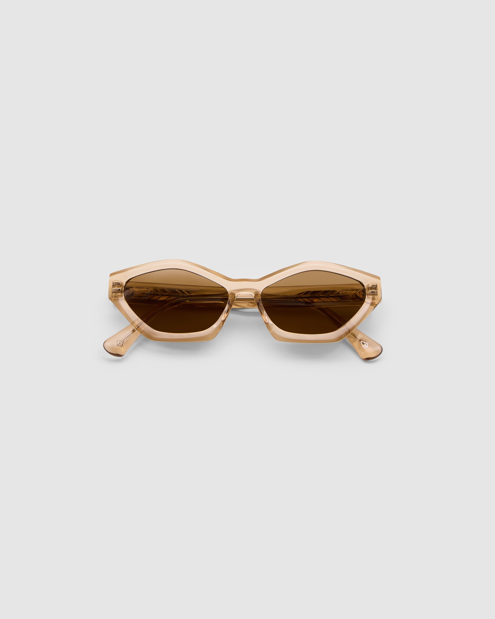 Franky Polarised Sunglasses by Tribu Eyewear — Champagne Crystal Cat-eye brown lens, flat view, grey background.