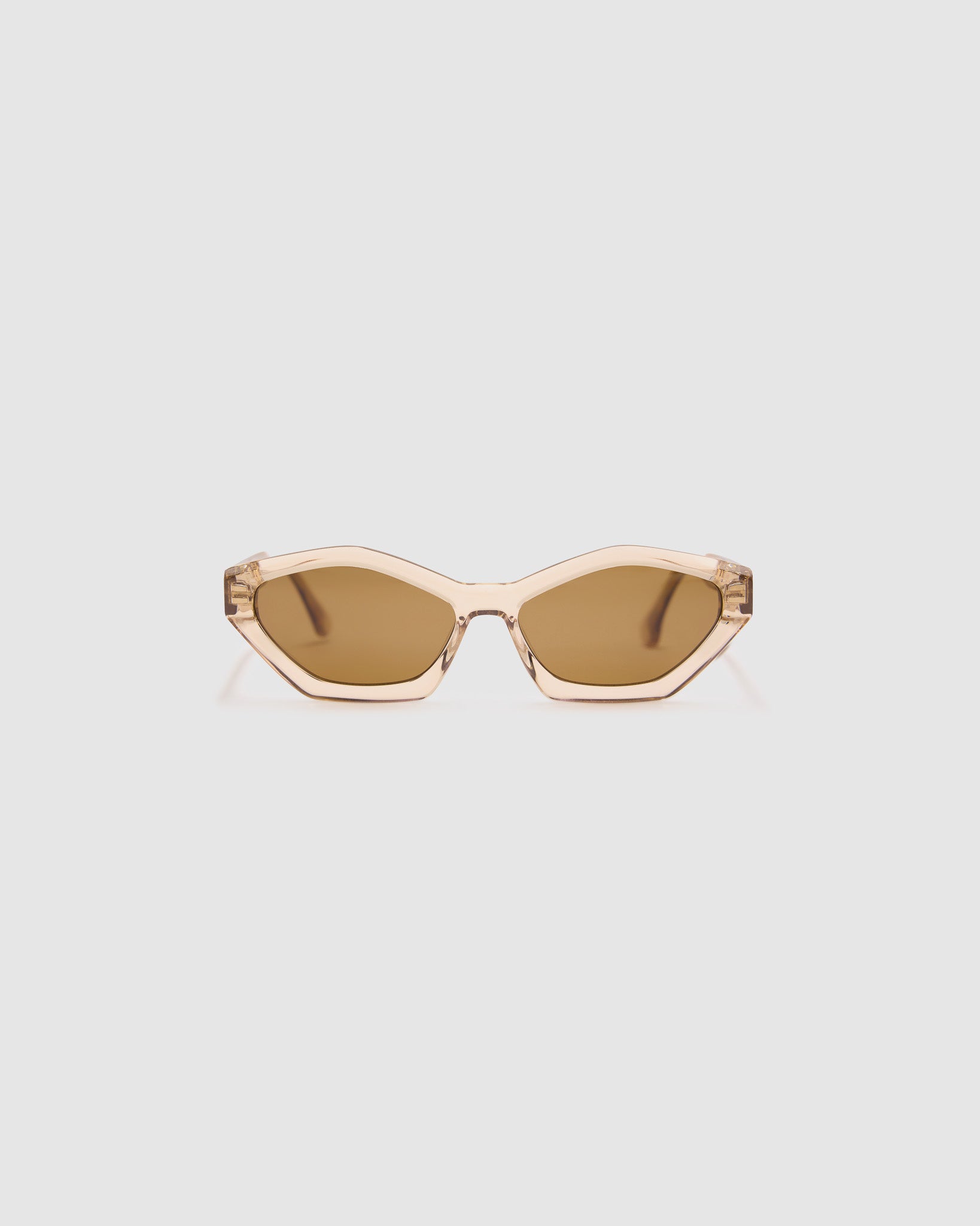 Franky Polarised Sunglasses by Tribu Eyewear — Champagne Crystal Cat-eye brown lens, front view, grey background.
