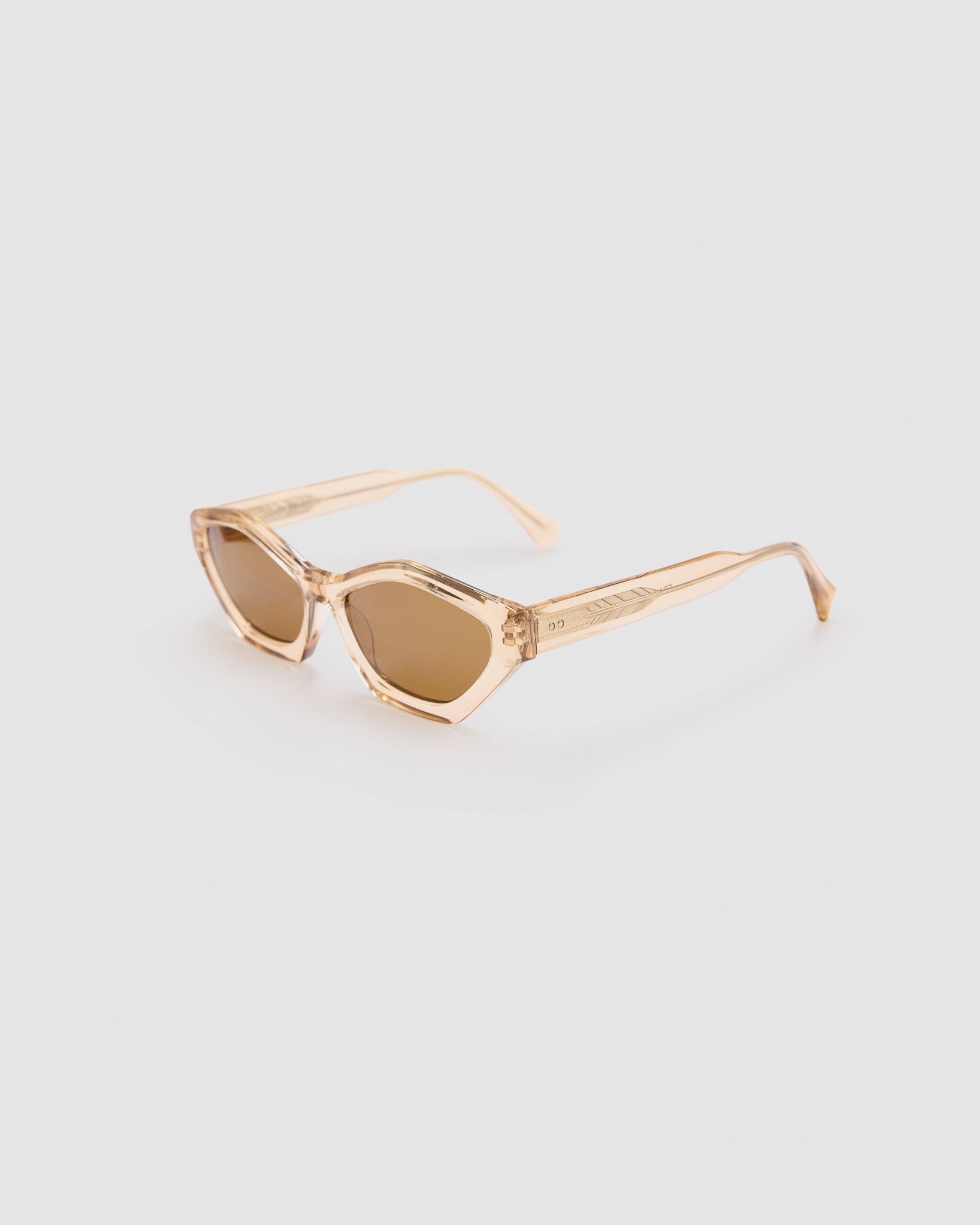 Franky Polarised Sunglasses by Tribu Eyewear — Champagne Crystal Cat-eye brown lens, side view, grey background.