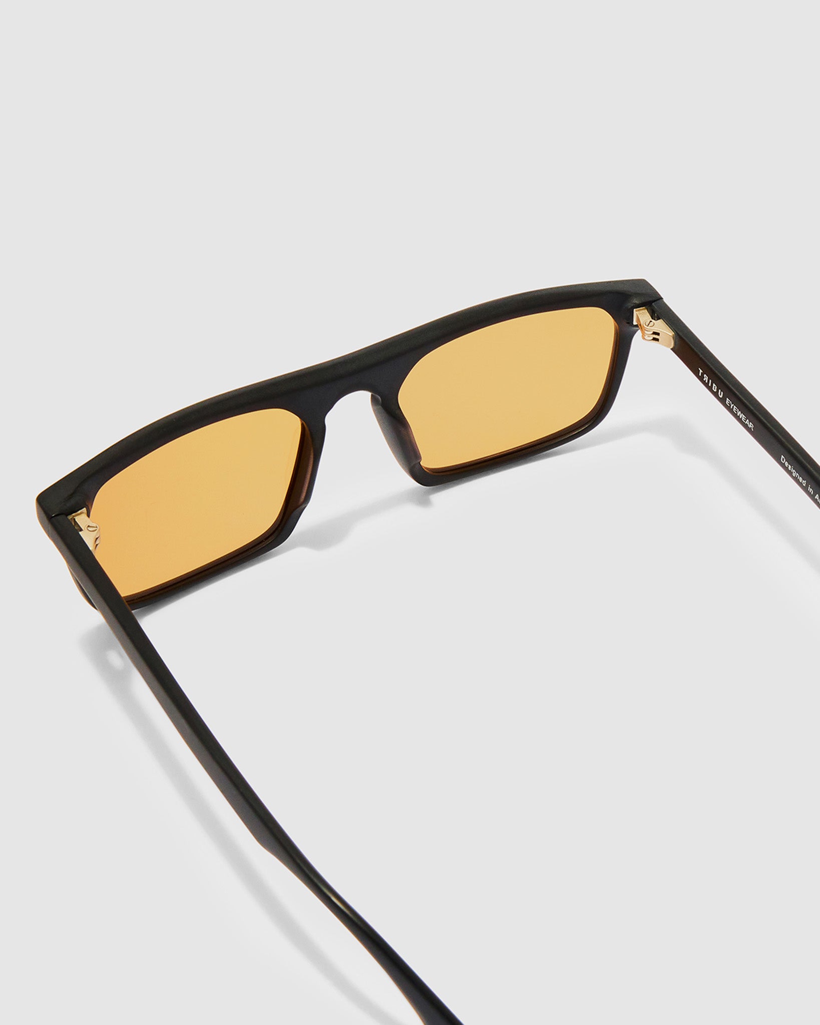 Gentleman Sunglasses by Tribu Eyewear — Matte balk acetate frame, desert orange lens detailed view.