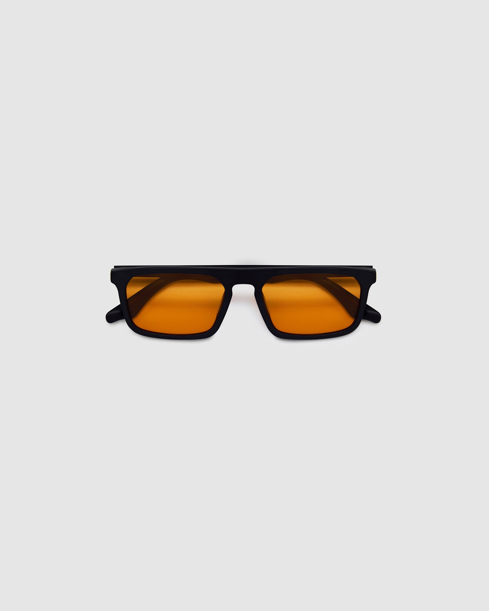 Gentleman Sunglasses by Tribu Eyewear — Matte balk acetate frame, desert orange lens flat view on a grey background.