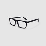 Gentleman Optical by Tribu Eyewear — matte black rectangular optical frame, side view on a grey background. 
