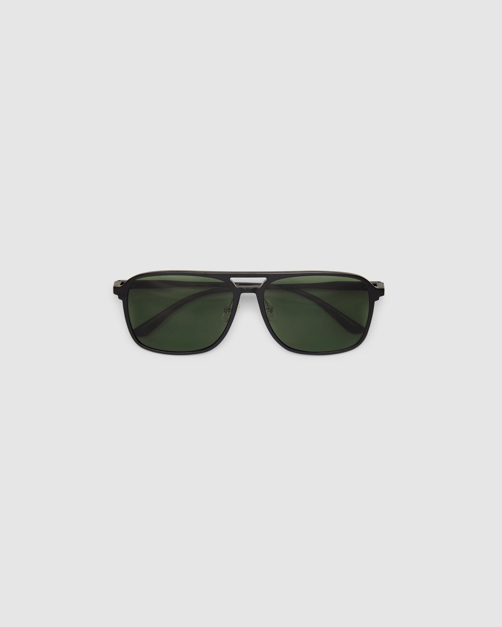 Oscar Sunglasses  by Tribu Eyewear — Metallic black aluminium aviator, green polarised lens, flat view on light grey background. 