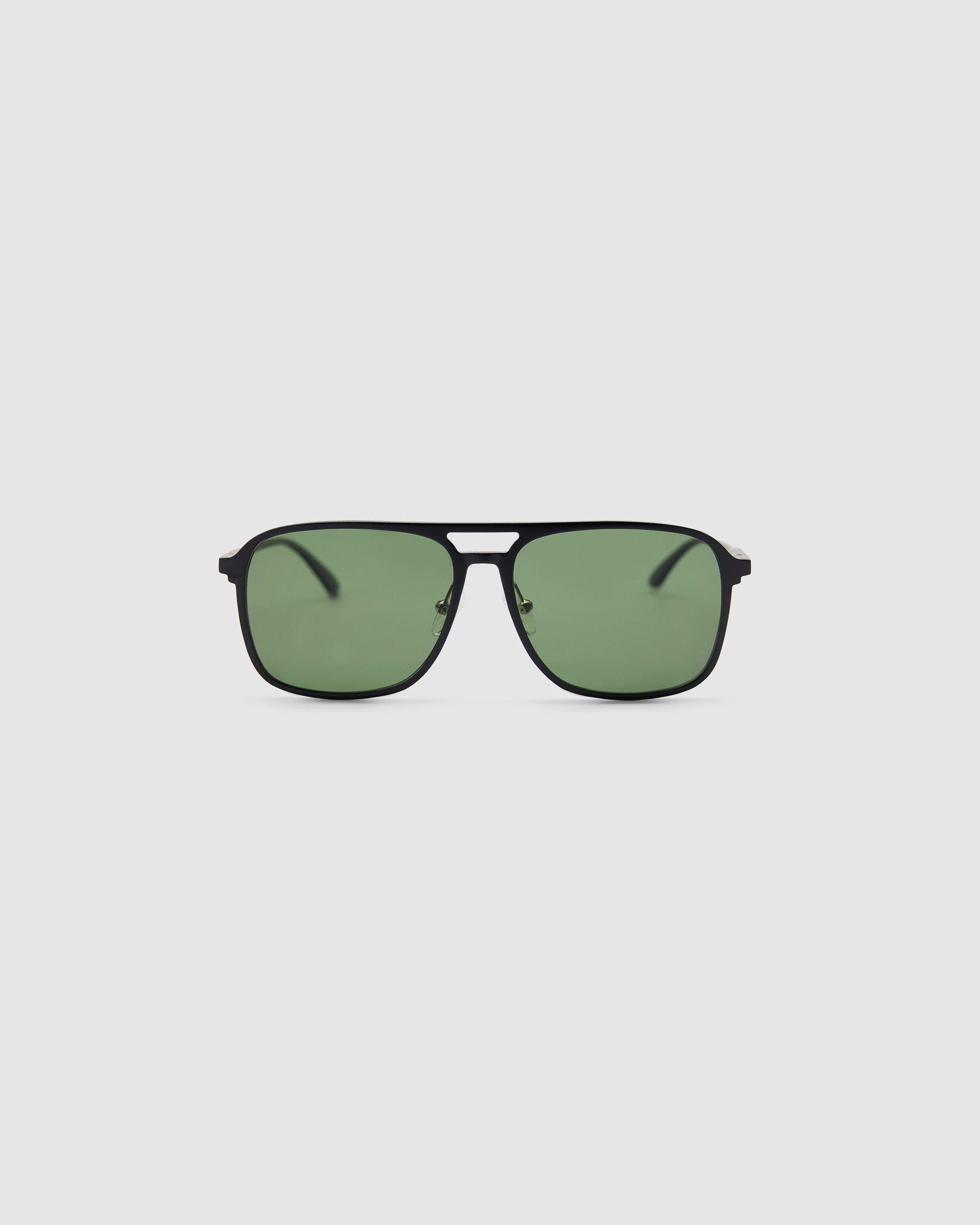 Oscar Sunglasses  by Tribu Eyewear — Metallic black aluminium aviator, green polarised lens, front view on light grey background. 