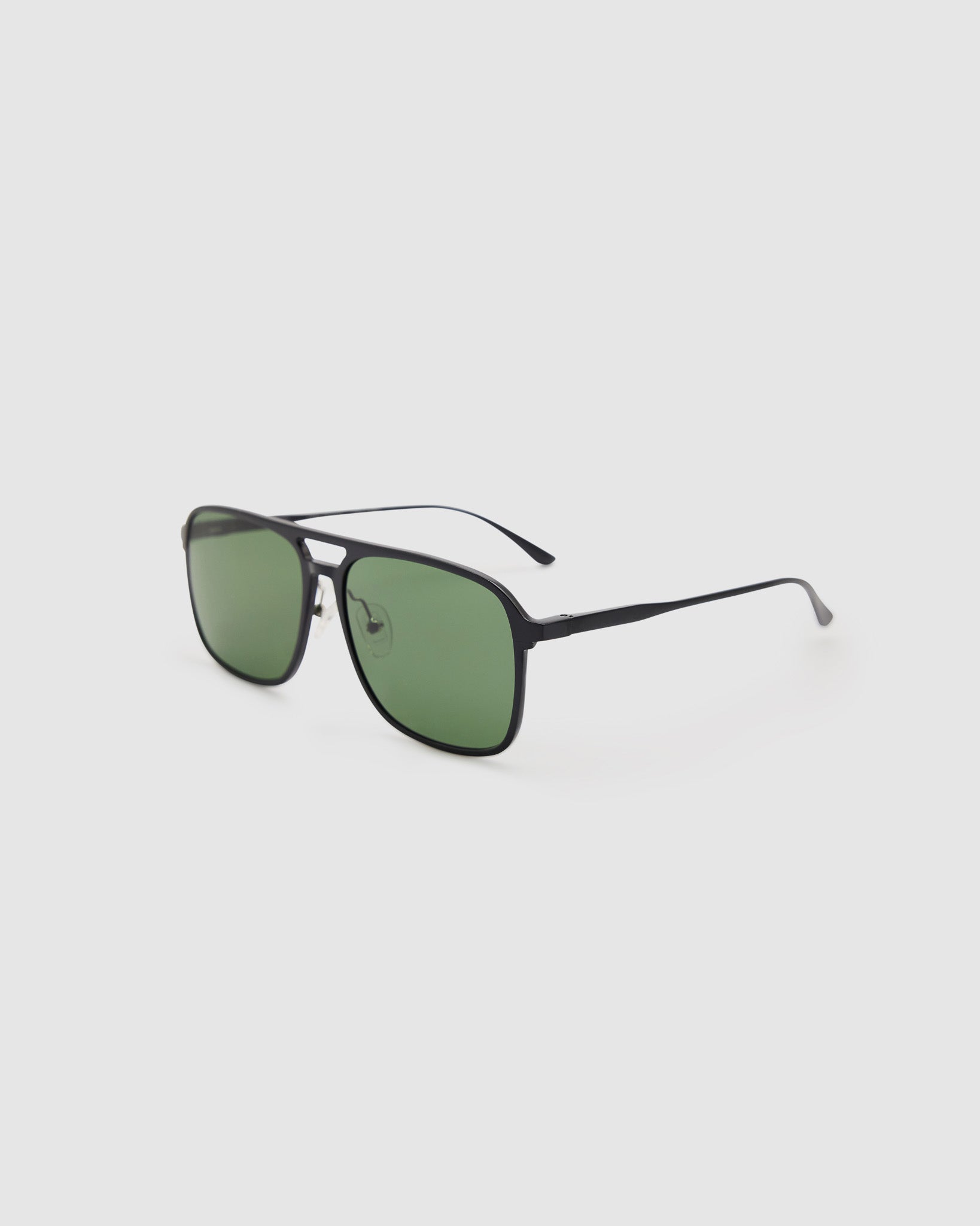 Oscar Sunglasses  by Tribu Eyewear — Metallic black aluminium aviator, green polarised lens, side view on light grey background. 