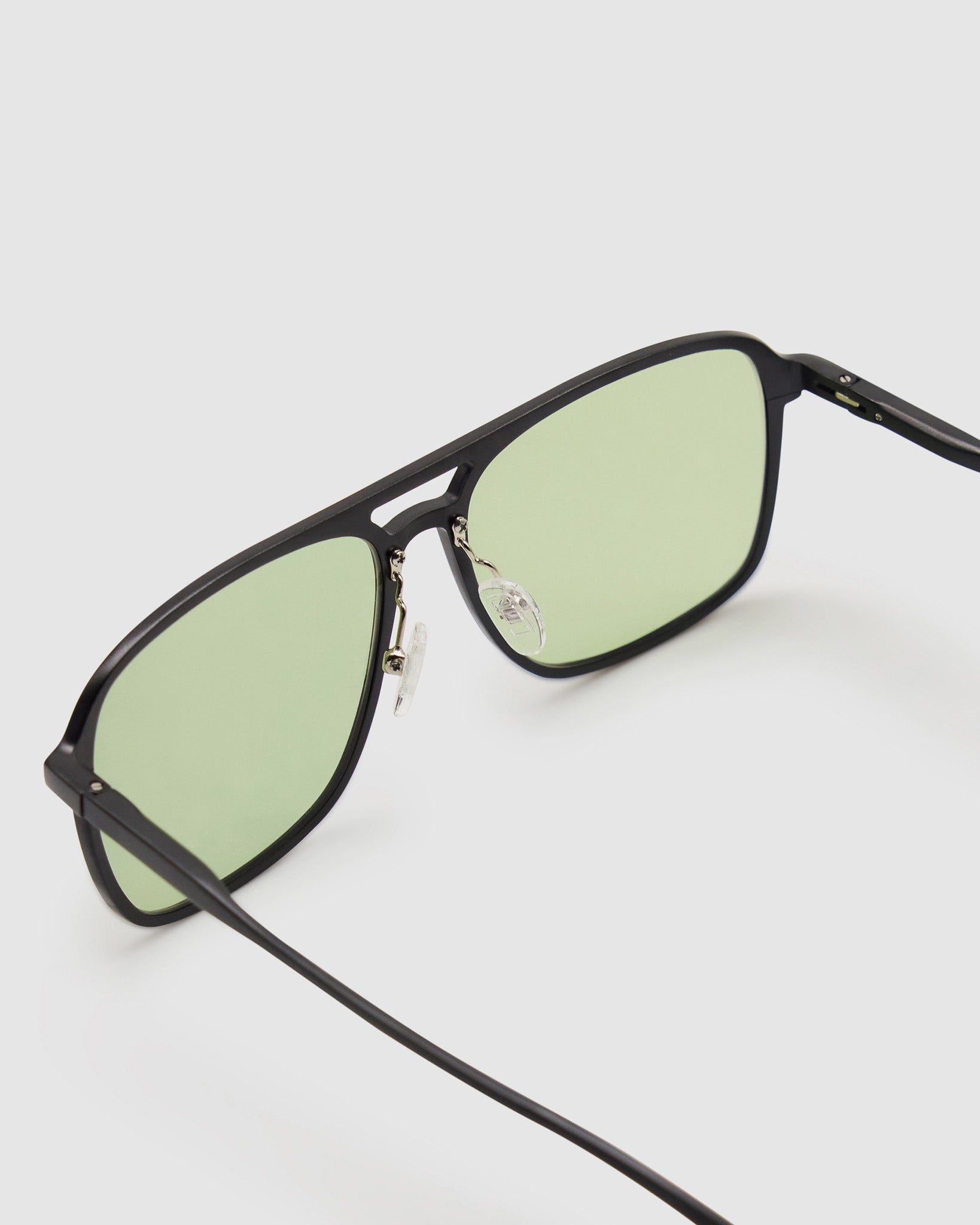 Oscar Sunglasses by Tribu Eyewear — Black Aluminium Aviator frame, Sage lens detailed view. 