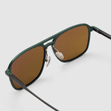 Oscar Sunglasses  by Tribu Eyewear — Forest green aviator, brown polarised lens detailed view on grey background. 
