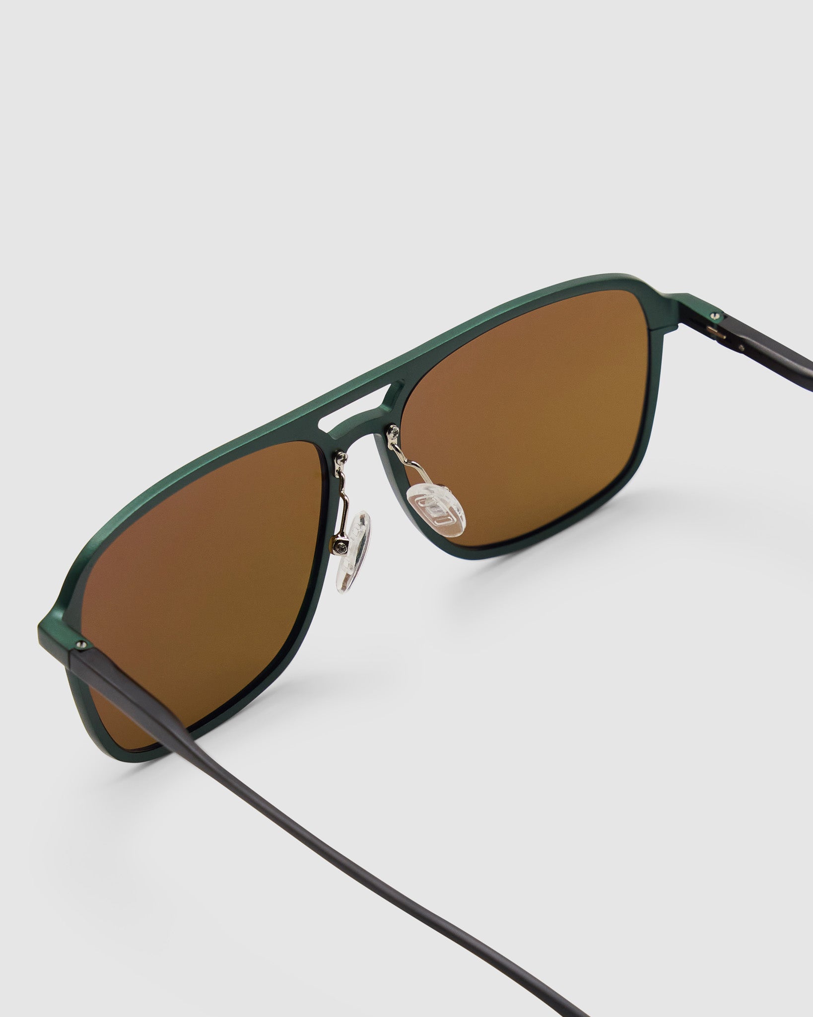 Oscar Sunglasses  by Tribu Eyewear — Forest green aviator, brown polarised lens detailed view on grey background. 