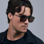 Oscar Sunglasses  by Tribu Eyewear — Forest green aviator, brown polarised lens on male model in studio. 