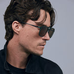 Oscar Sunglasses  by Tribu Eyewear — Forest green aviator, brown polarised lens on male model.