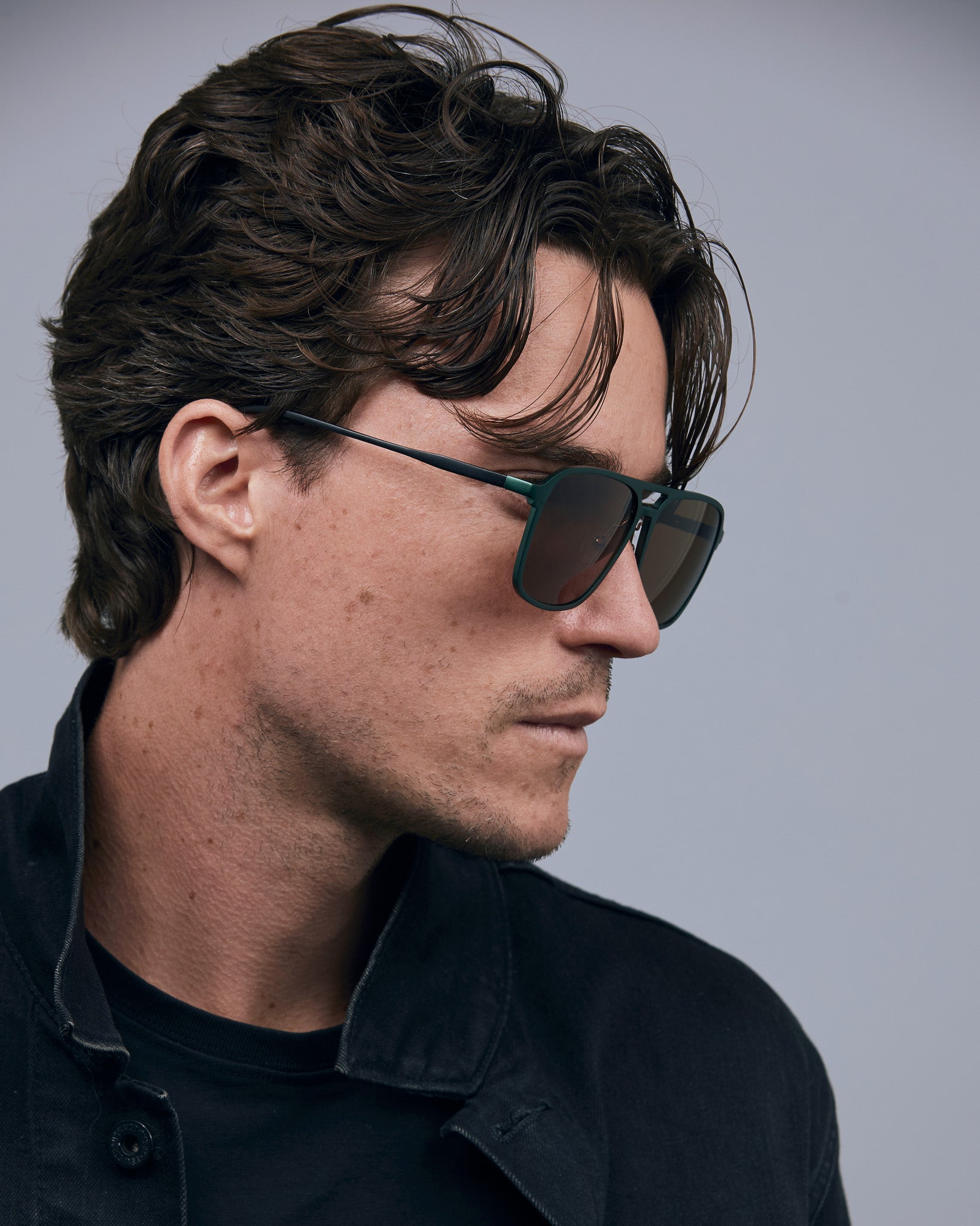 Oscar Sunglasses  by Tribu Eyewear — Forest green aviator, brown polarised lens on male model.