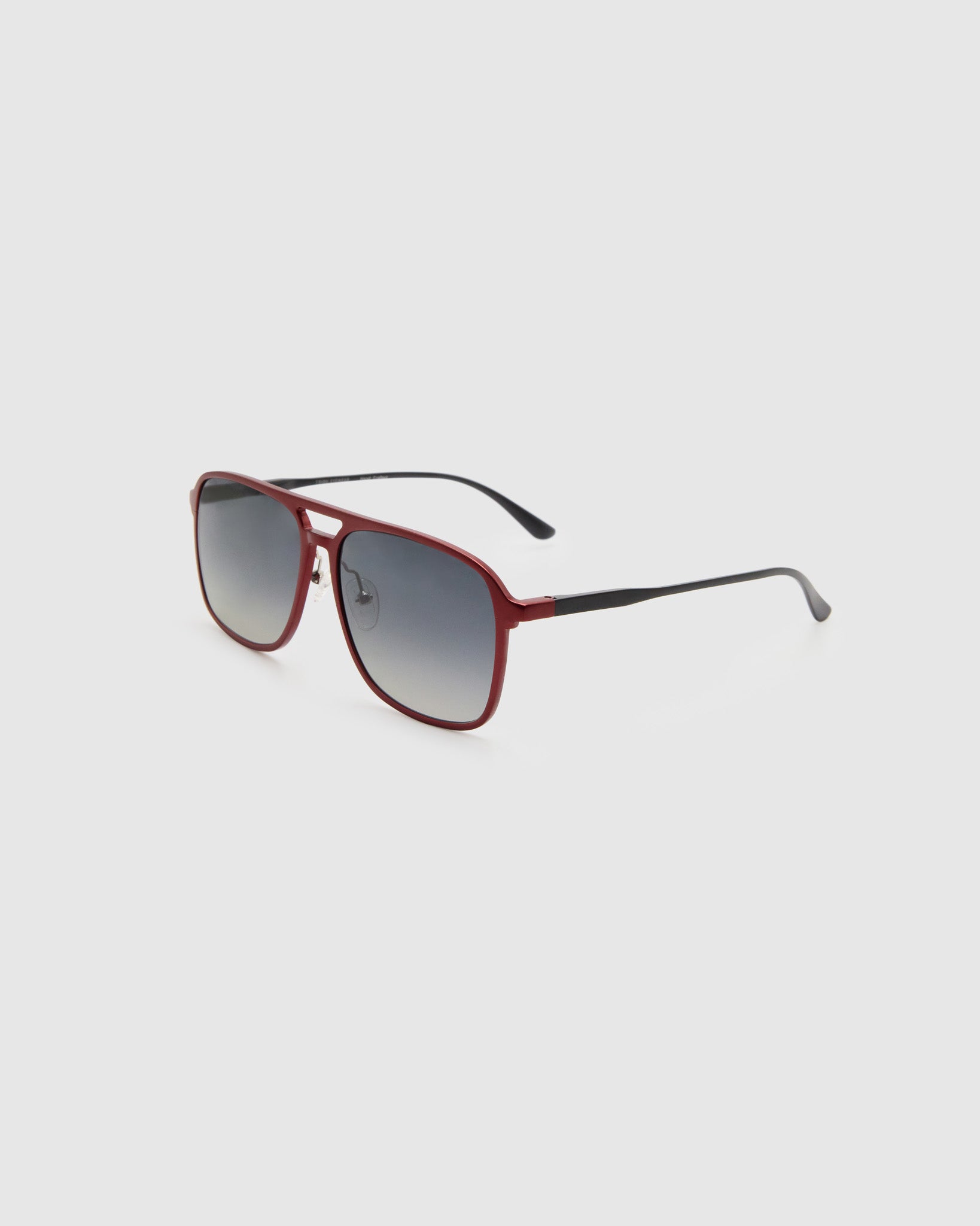 Oscar Polarised Sunglasses by Tribu Eyewear —   Metallic Burgundy Aluminium Aviator frame, grey grad lens, side view light grey background.