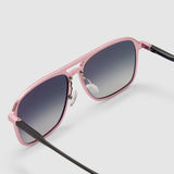 Oscar Sunglasses  by Tribu Eyewear — Metallic pink aluminium aviator, grey grad polarised lens, detailed view on grey background.