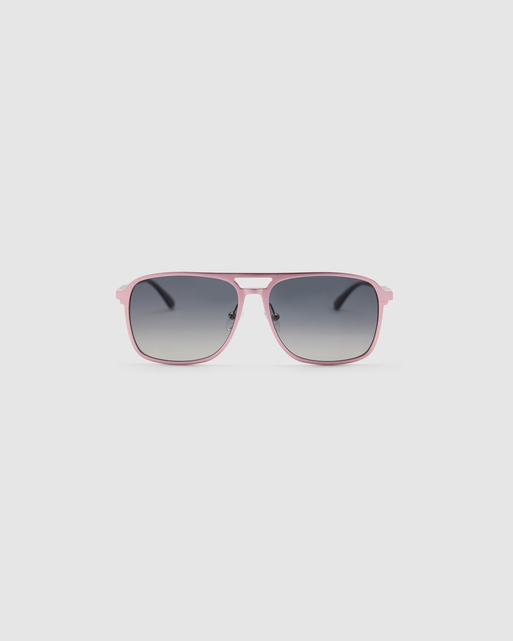 Oscar Sunglasses  by Tribu Eyewear — Metallic pink aluminium aviator, grey grad polarised lens, front view on light grey background. 
