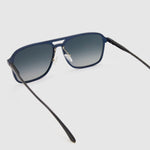 Oscar Polarised Sunglasses by Tribu Eyewear —   Midnight Blue Aluminium Aviator frame, grey grad lens, detailed view light grey background.