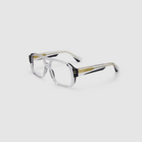 The DON Optical by Tribu Eyewear — Black on Crystal Aviator frame, side view studio lighting. 