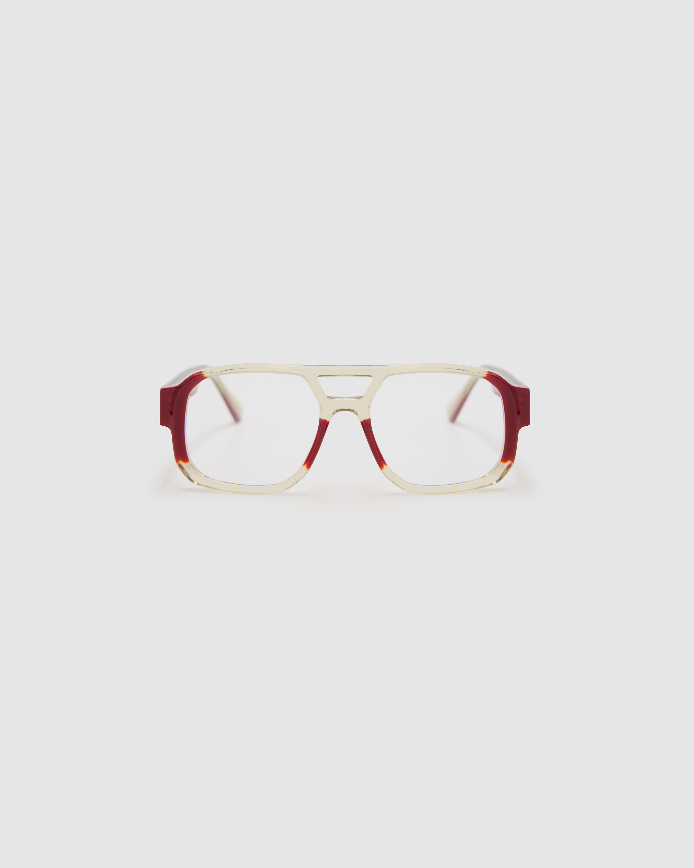 The DON Optical by Tribu Eyewear — Deep Red on Smoke Aviator frame, front view studio lighting. 