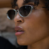 Model wearing TRIBU Nardi baby blue and silver cat-eye sunglasses.