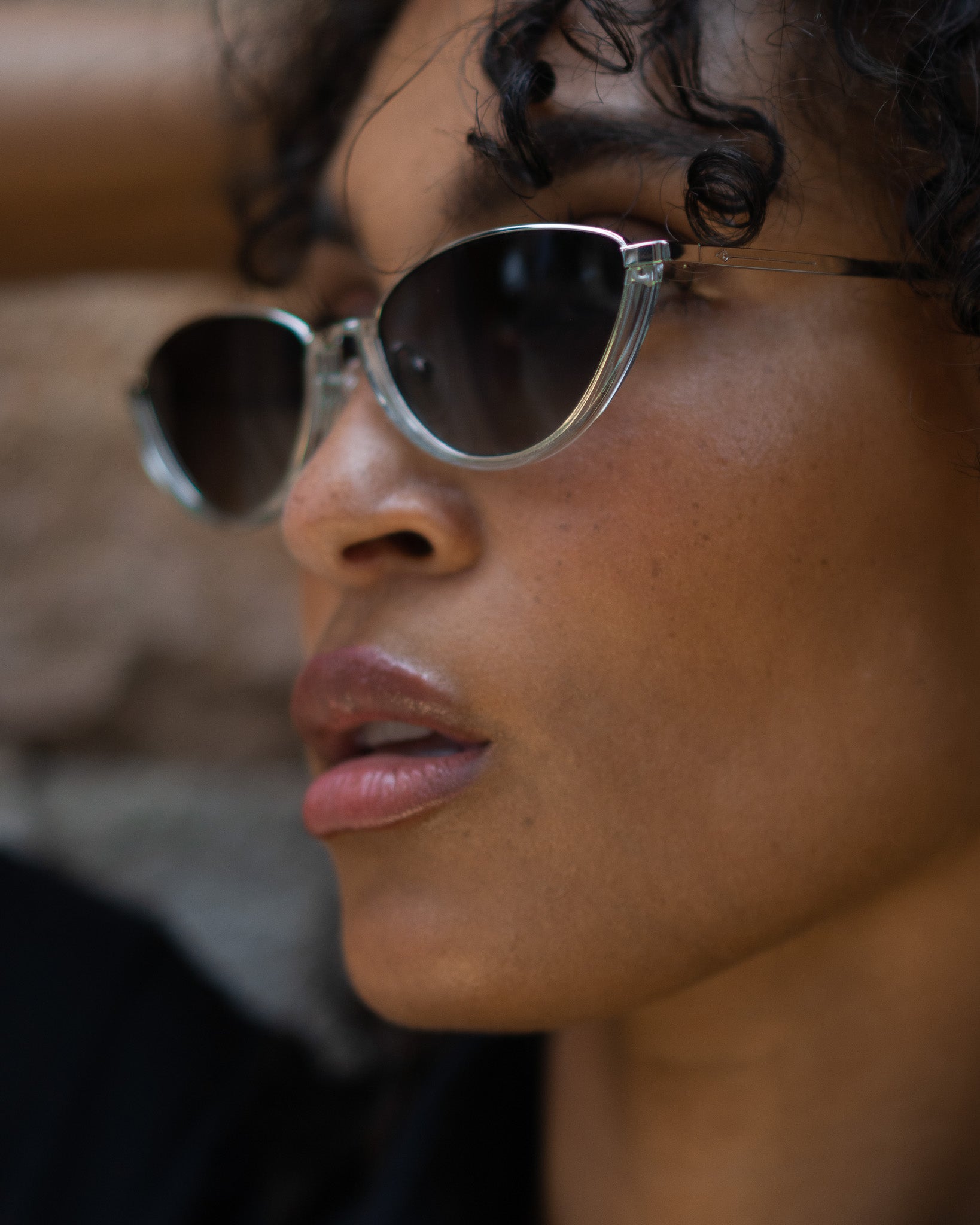 Model wearing TRIBU Nardi baby blue and silver cat-eye sunglasses.