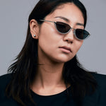 Model wearing TRIBU Nardi baby blue and silver cat-eye sunglasses.