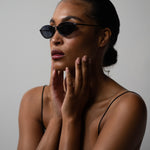 Model wearing TRIBU Nardi Black Cat-eye sunglasses