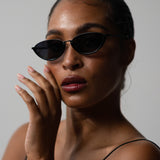 Model wearing TRIBU Nardi Black cat-eye sunglasses  