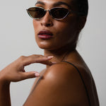 Model wearing TRIBU Nardi tort and silver cat-eye sunglasses.